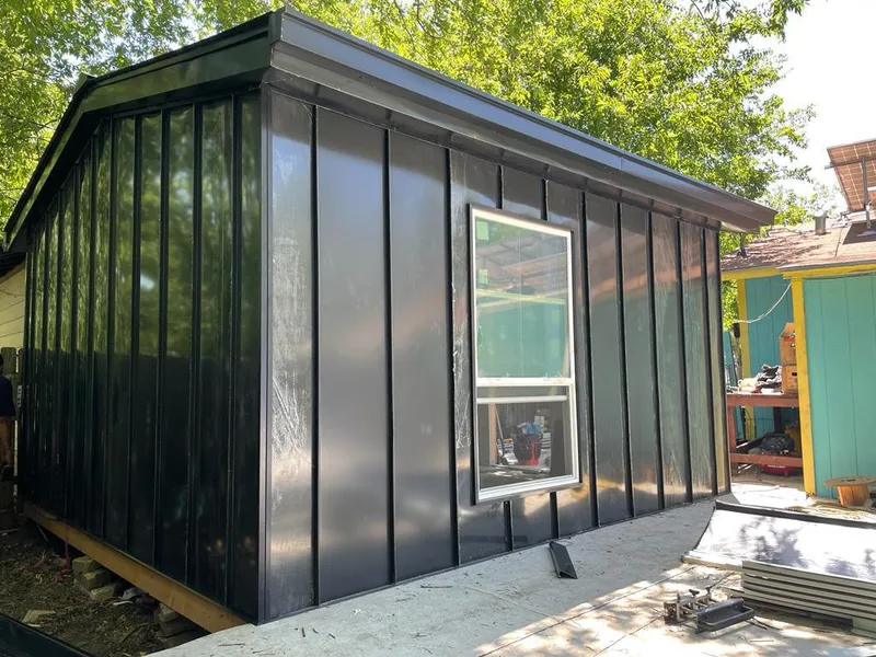 Black standing seam metal wall panels for Roof Inspection in Rumford