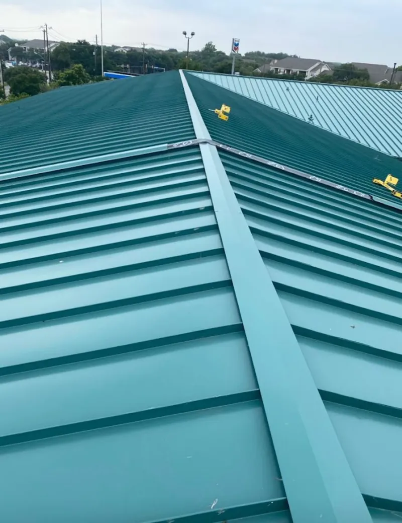 Green commercial metal roof ridge and valley for Metal Roof Repair in Rumford