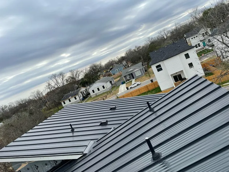 Standing seam metal roof panels with vents for Skylight Repair in Rumford